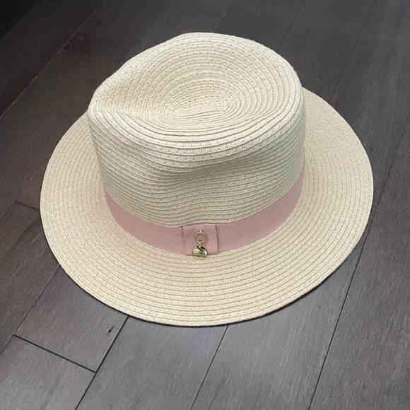 Melissa Odabash cream toned fedora hat with pale pink ribbon band and gold charm